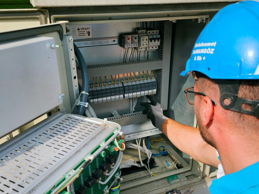 Outdoor switchboard being repaired after weather damage