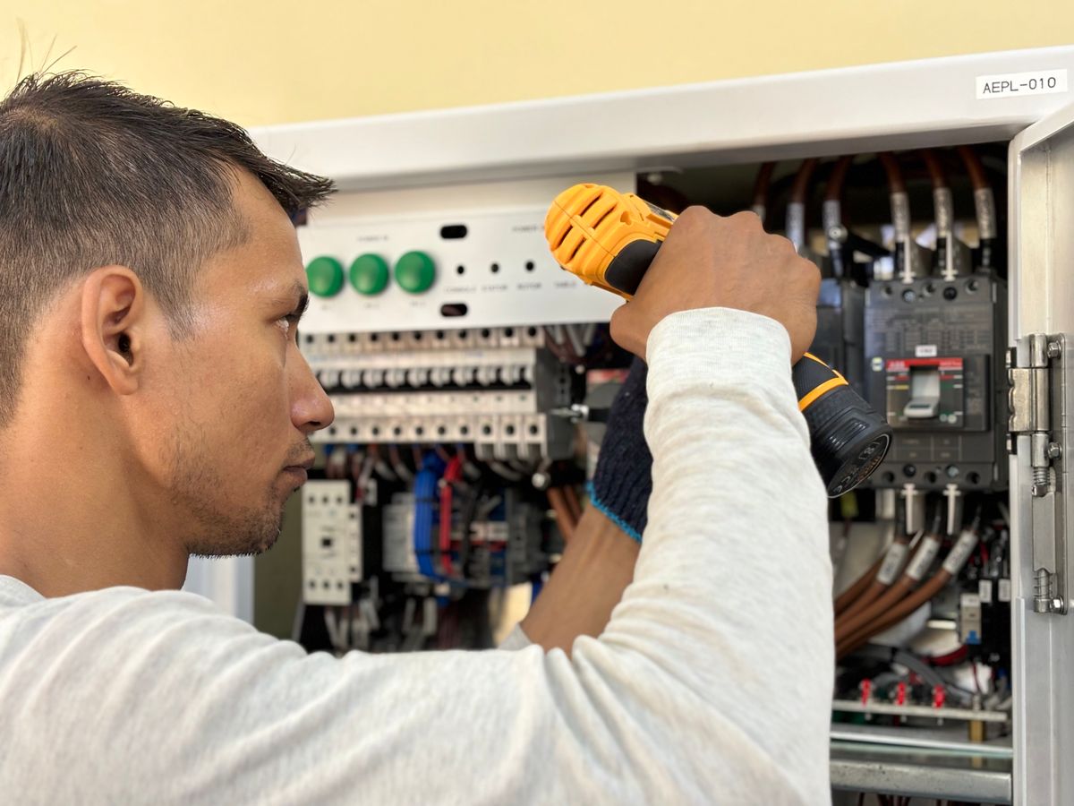 Arcwell electrician installing a new residential switchboard with clean circuit labelling