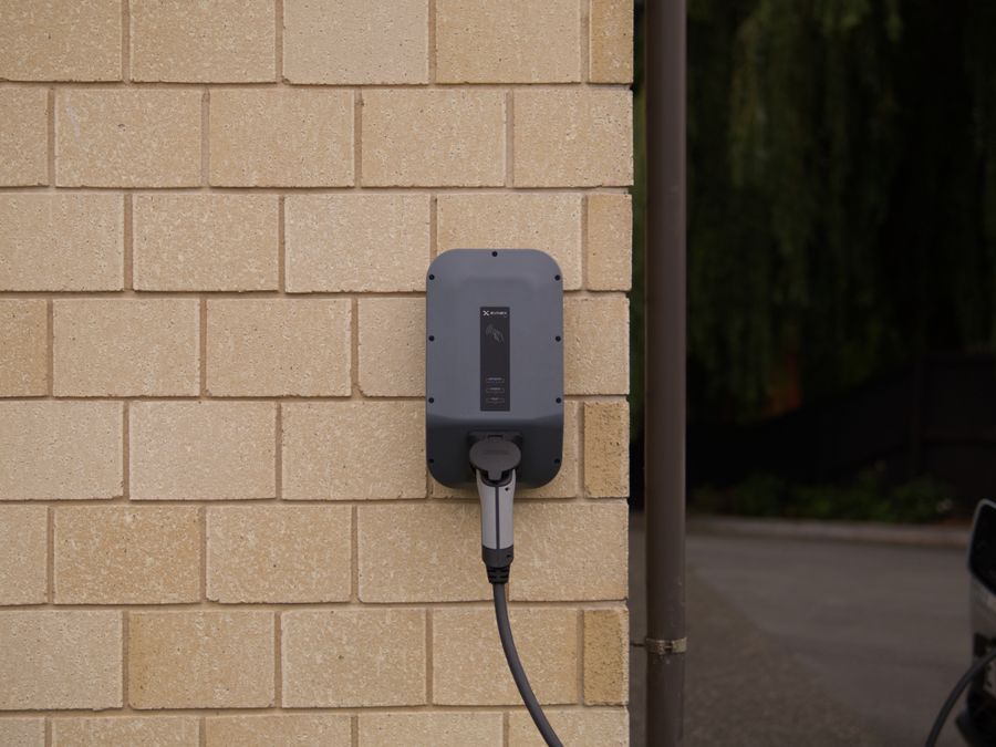 Wall-mounted Level 2 EV charger installed in a residential garage